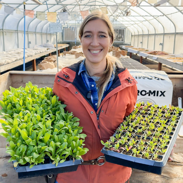 Erin Benzakein holding trays of seedlings from the Potting Soil Experiment